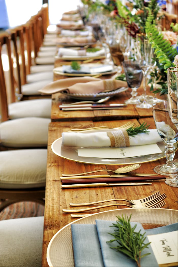 Home Close-up of a beautifully arranged table setting with flowers and cutlery, perfect for weddings or fine dining.